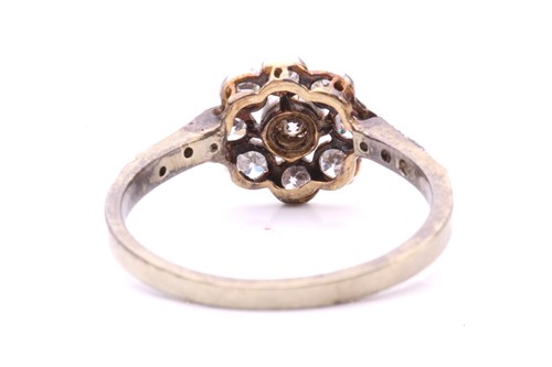 Lot 231 - A diamond floral cluster ring, set with a...