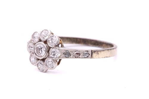 Lot 231 - A diamond floral cluster ring, set with a...