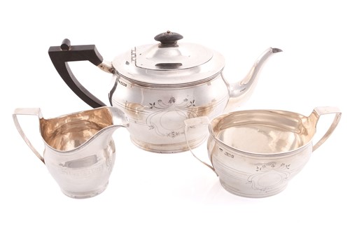 Lot 411 - An Edward VII three-piece silver tea set,...