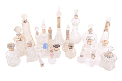 Lot 473 - A good collection of cut glass scent bottles,...