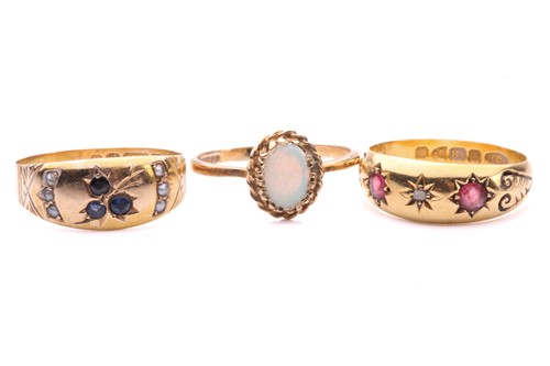 Lot 242 - Three gem-set gold rings; including a star-set...