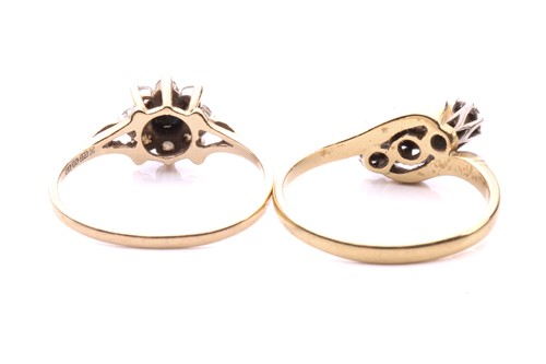 Lot 248 - A three stone diamond cross over ring, with a...