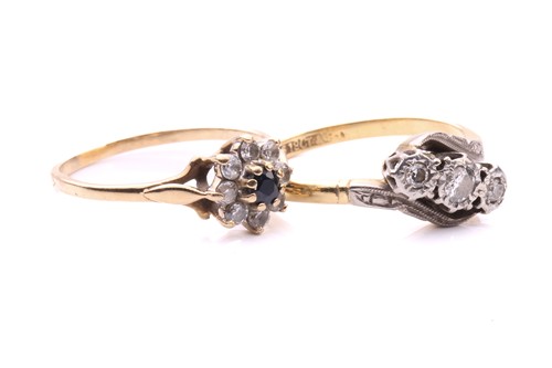 Lot 248 - A three stone diamond cross over ring, with a...