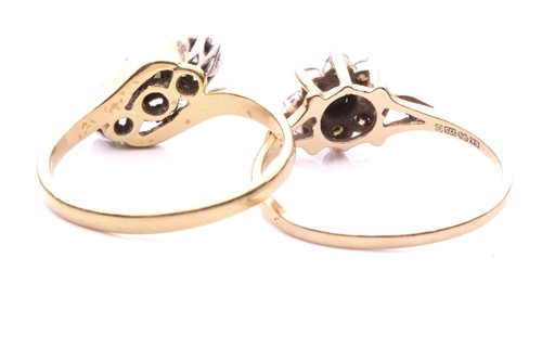 Lot 248 - A three stone diamond cross over ring, with a...