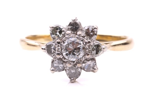 Lot 214 - A diamond cluster ring, the flowerhead centred...