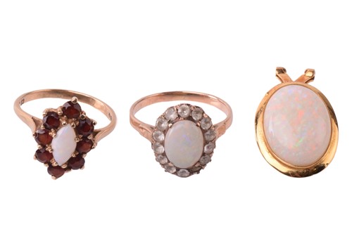 Lot 135 - Two opal cluster dress rings and a pendant;...