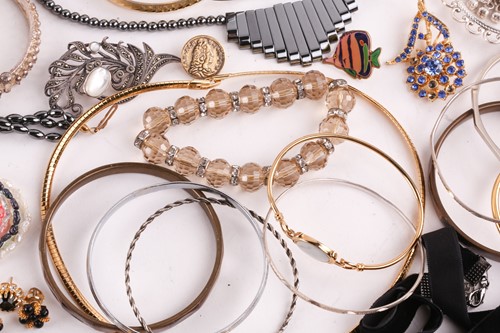 Lot 180 - A Hermatite pearl and gold plated bead...