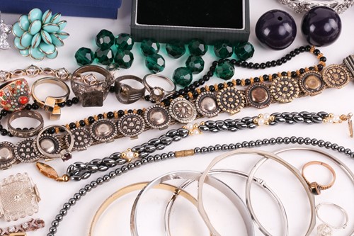 Lot 180 - A Hermatite pearl and gold plated bead...