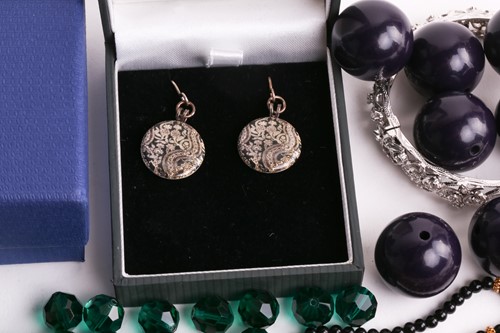 Lot 180 - A Hermatite pearl and gold plated bead...