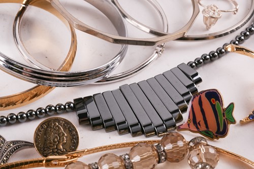 Lot 180 - A Hermatite pearl and gold plated bead...