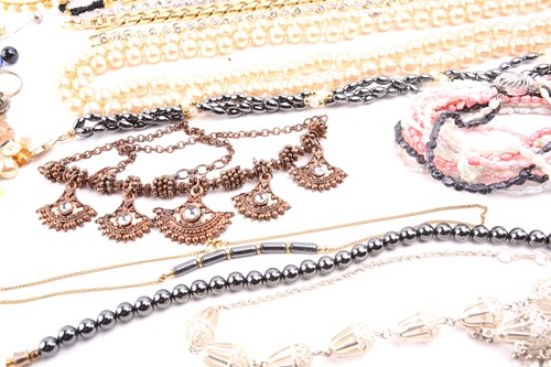 Lot 180 - A Hermatite pearl and gold plated bead...