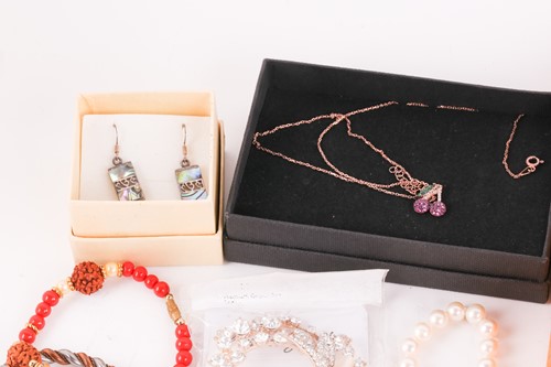 Lot 180 - A Hermatite pearl and gold plated bead...