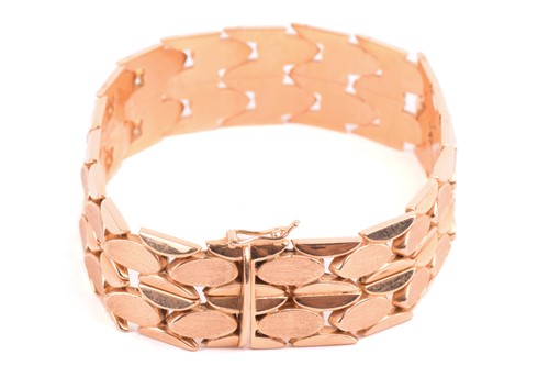 Lot 173 - A fancy link bracelet of ovoid design, with...