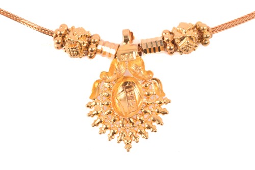 Lot 192 - An Indian pendant on chain, composed of a...