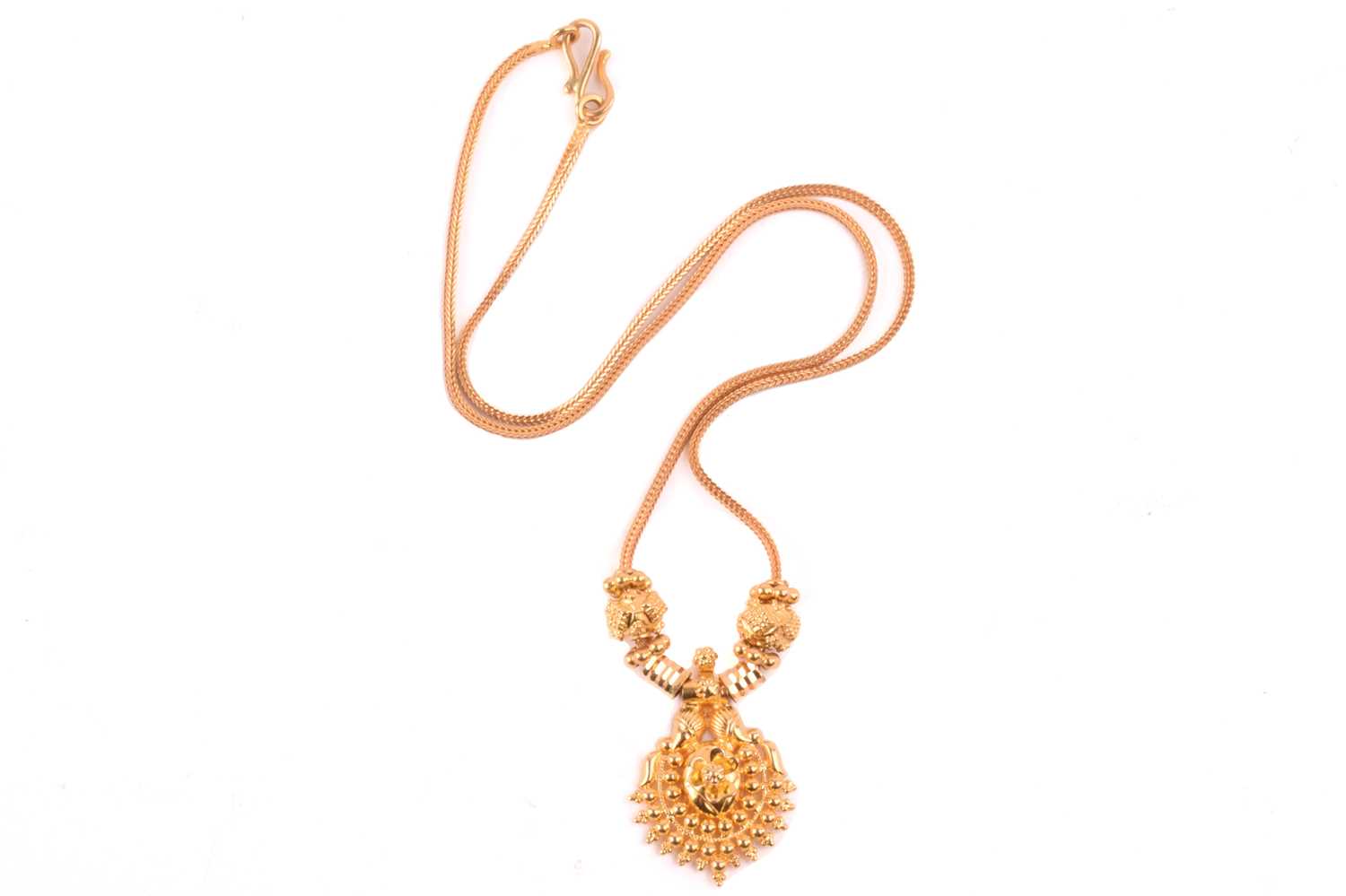 Lot 192 An Indian pendant on chain, composed of a