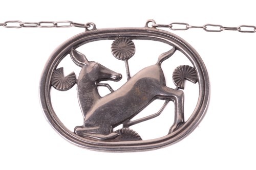 Lot 257 - Georg Jensen - a necklace with kneeling fawn...