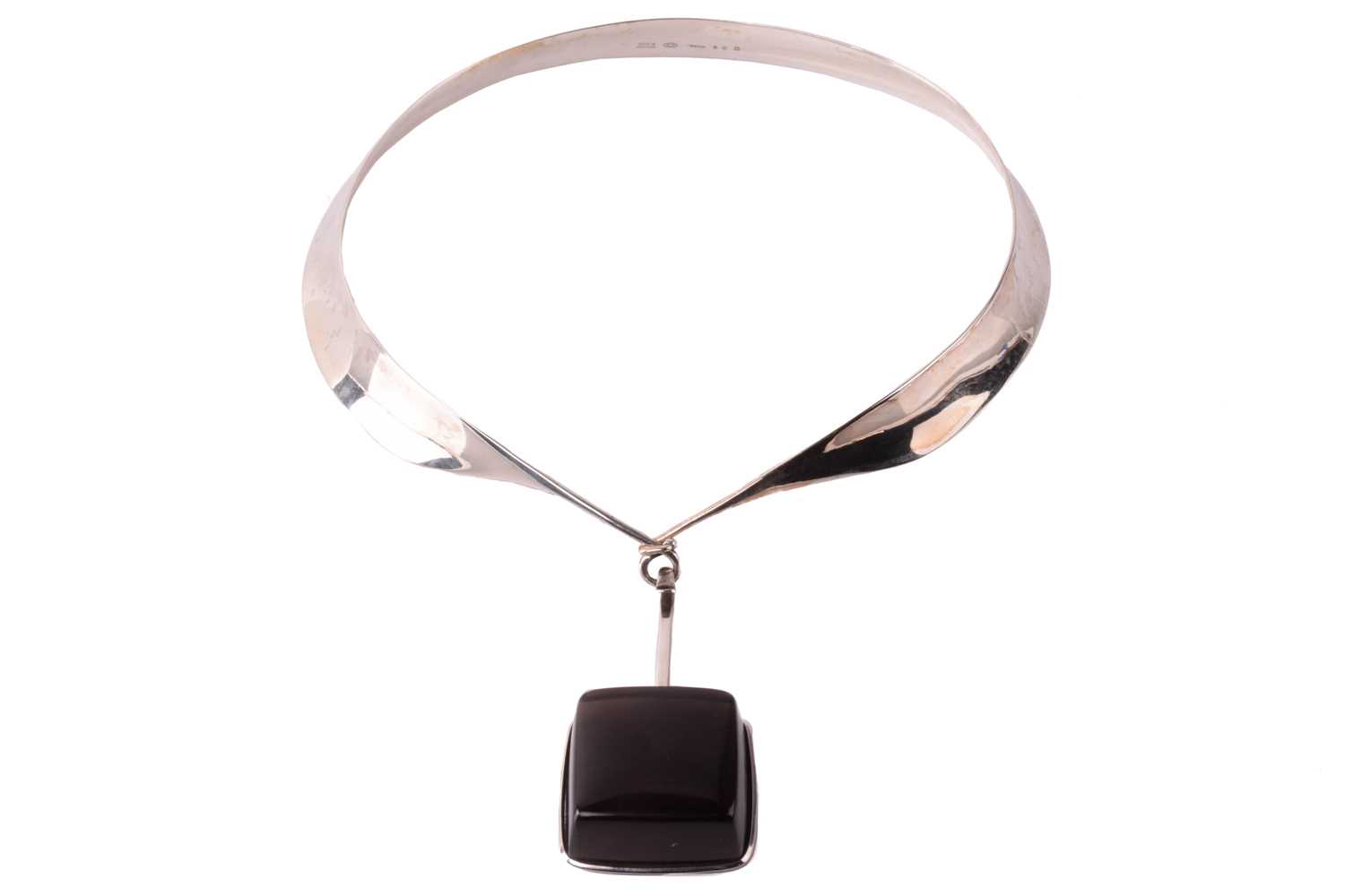 Lot 254 - Georg Jensen - 'Neck Ring' with square smoky...