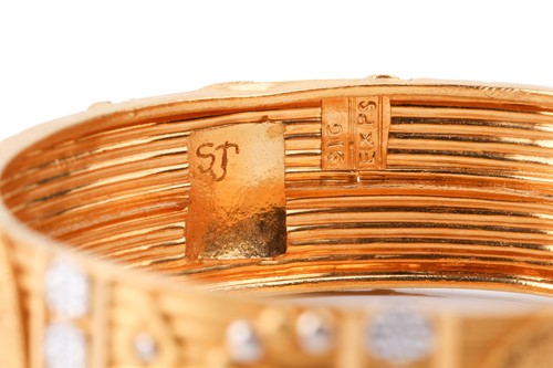 Lot 187 - An Indian closed bangle, of geometrical design,...