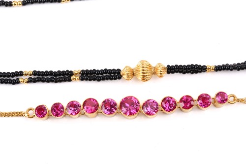 Lot 209 - A pink synthetic sapphire suite in gold plated...