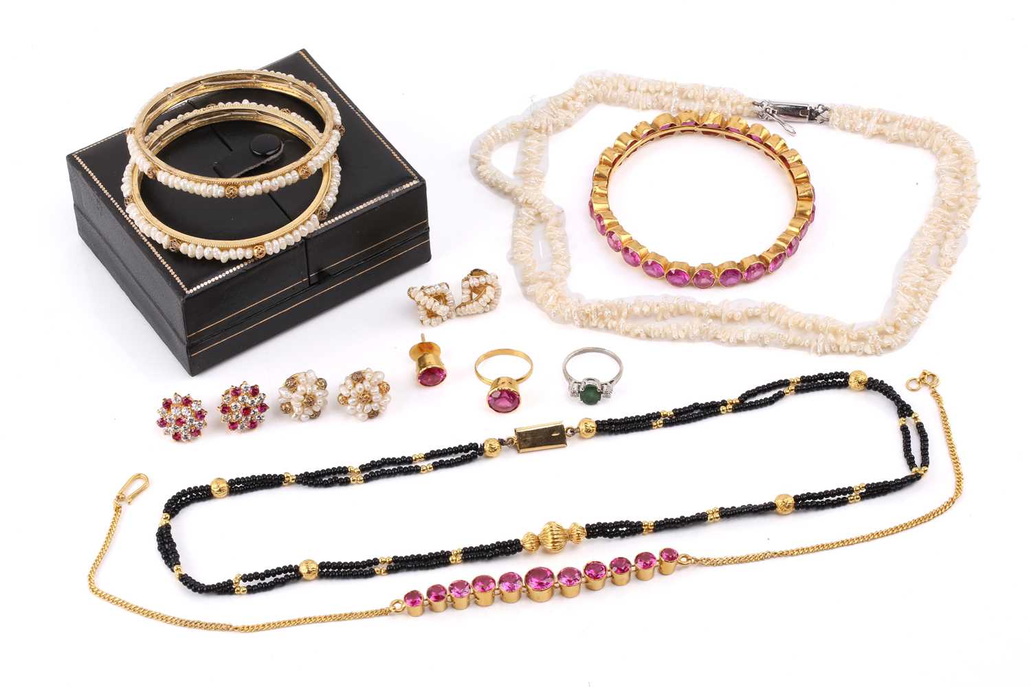 Lot 209 - A pink synthetic sapphire suite in gold plated...