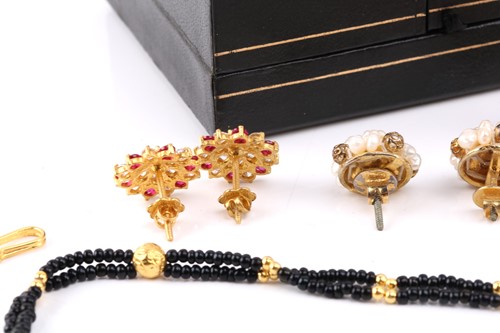 Lot 209 - A pink synthetic sapphire suite in gold plated...