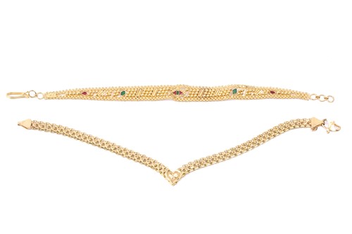 Lot 53 - Two 22ct yellow gold bracelets; the first...