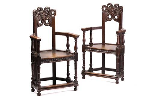 Lot 344 - A pair of French carved oak caquetoire...