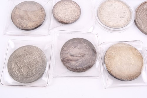 Lot 284 - A collection of silver content world coins,...