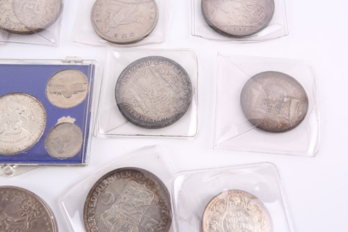 Lot 284 - A collection of silver content world coins,...