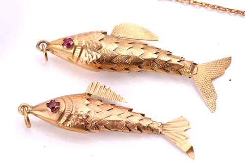 Lot 118 - Two articulated fish pendants in yellow metal...
