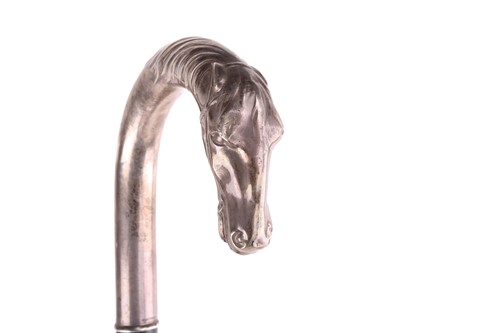 Lot 537 - An ebonised walking stick with white metal...