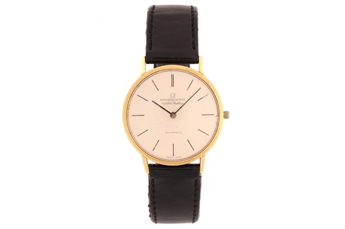 Lot 361 - A Universal Geneve golden shadow automatic...