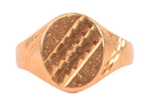 Lot 51 - A 22ct yellow gold signet ring, the oval ring...
