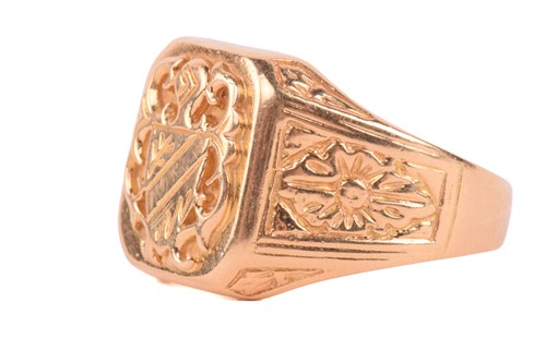 Lot 219 - A signet ring of heraldic design, with floral...