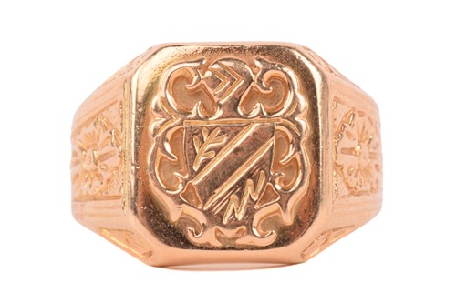 Lot 219 - A signet ring of heraldic design, with floral...