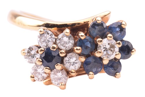 Lot 84 - A sapphire and diamond double daisy cluster...
