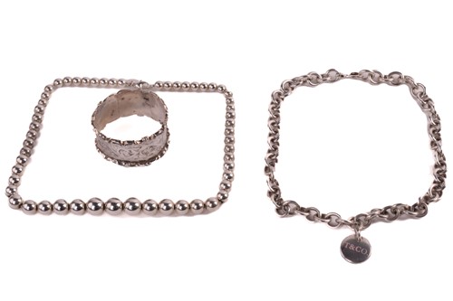 Lot 27 - Two Tiffany & Co. silver necklaces and a...