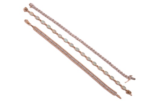 Lot 20 - Three gem-set line bracelets in 9ct gold; the...