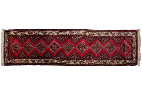 Lot 366 - A Hamadan red ground strip runner, with nine...