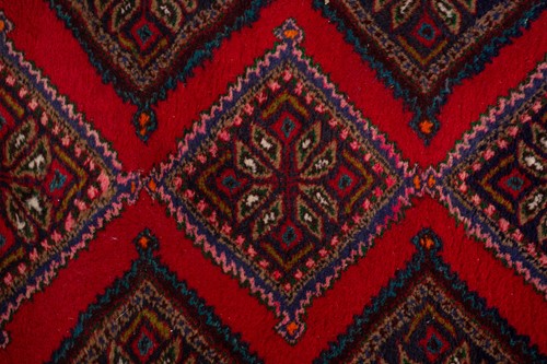 Lot 366 - A Hamadan red ground strip runner, with nine...