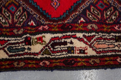 Lot 366 - A Hamadan red ground strip runner, with nine...