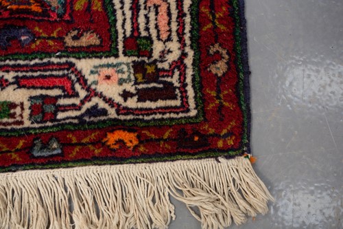 Lot 366 - A Hamadan red ground strip runner, with nine...