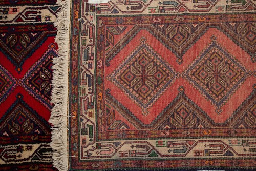 Lot 366 - A Hamadan red ground strip runner, with nine...
