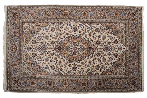 Lot 370 - A large Ivory ground Nain carpet with central...