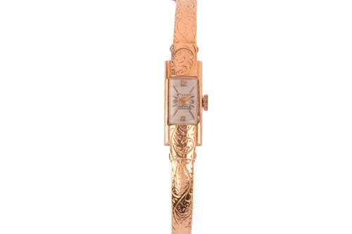 Lot 421 - An 18ct gold Pallas lady's dress watch,...