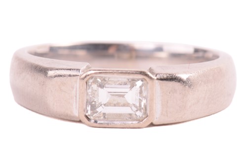 Lot 214 - A diamond solitaire ring in 18ct white gold...