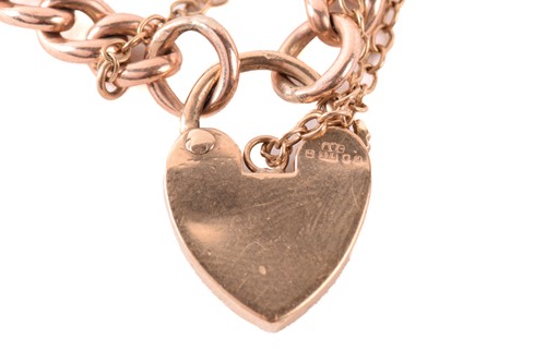 Lot 236 - A 9ct gold curb link bracelet with heart...