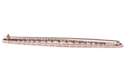 Lot 274 - A diamond bar brooch, circa 1930, designed as...