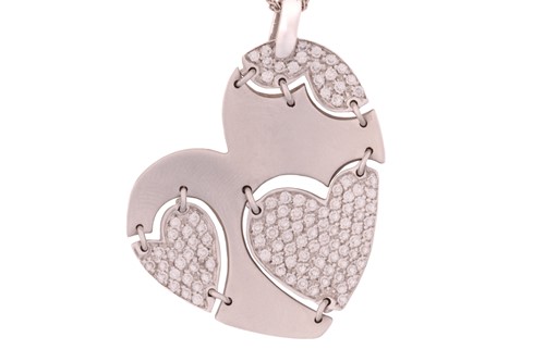 Lot 74 - An 18ct white gold diamond-set heart pendant...