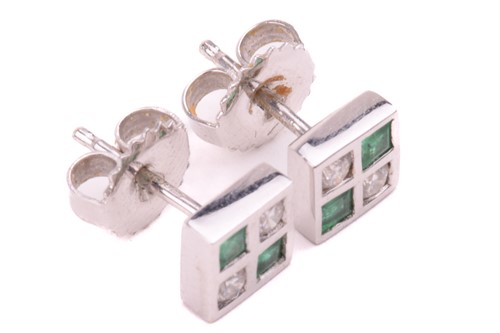 Lot 22 - A pair of emerald and diamond stud earrings in...